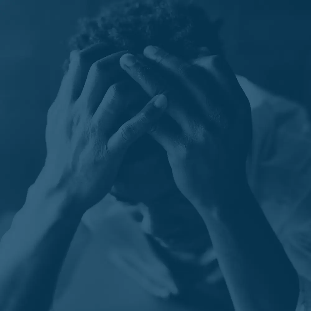 man with head in his hands