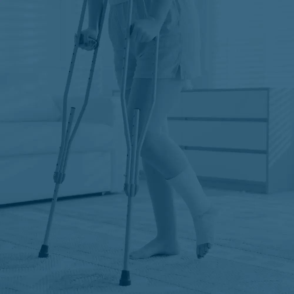 woman with sprained ankle on crutches